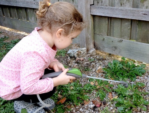 Child with weed killer spray